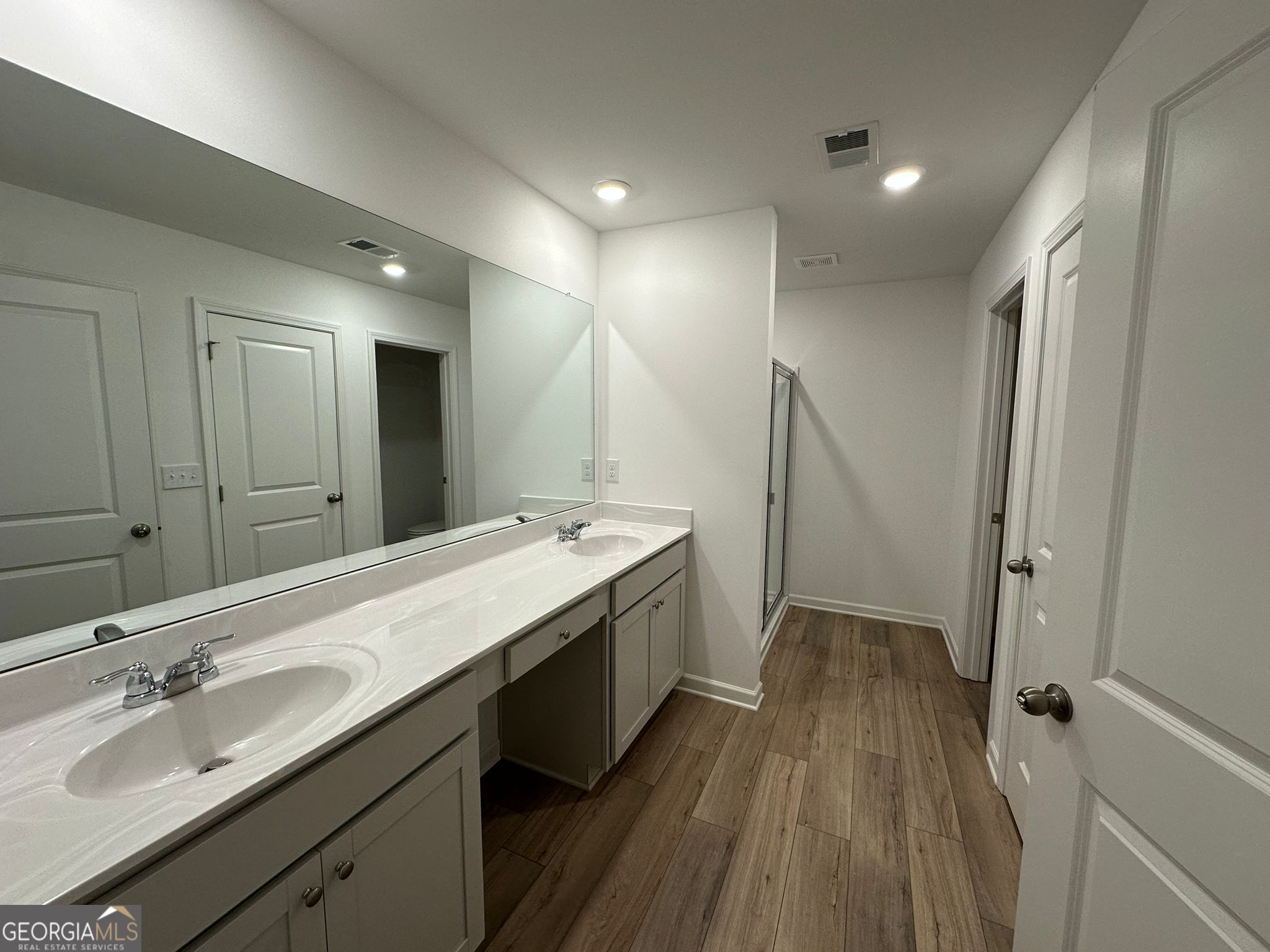 4281 Marsha Street Doraville, GA 30360 - Photo 30 of 38 a spacious bathroom with a double vanity sink and a mirror