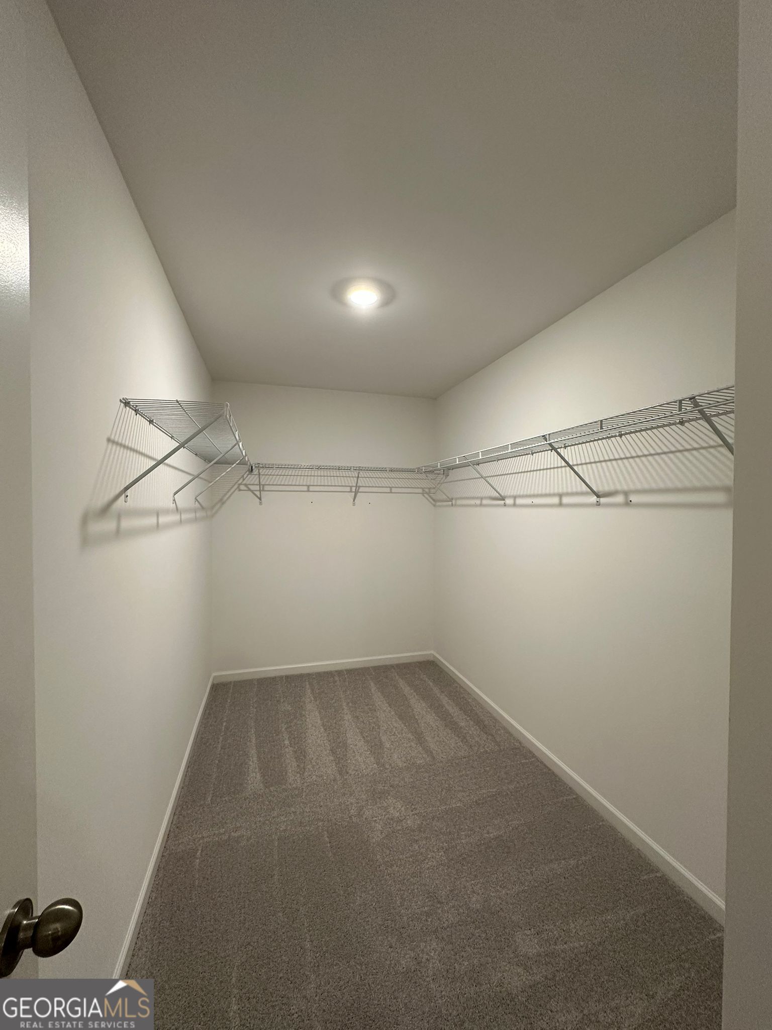 4281 Marsha Street Doraville, GA 30360 - Photo 31 of 38 a view of a room with racks on the wall