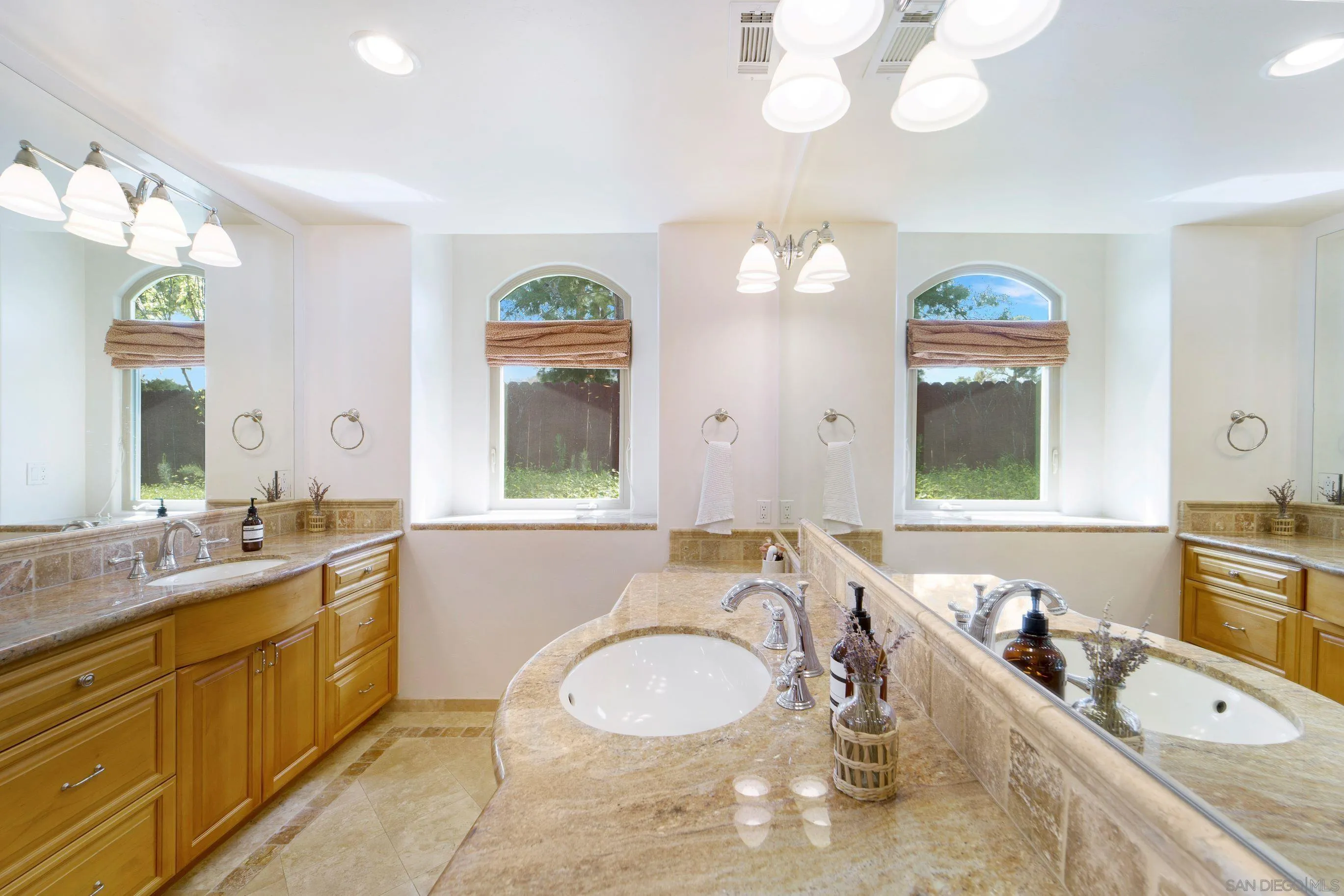 16163 Del Norte Poway, CA 92064 - Photo 15 of 41 a bathroom with a granite countertop double vanity sink and a mirror