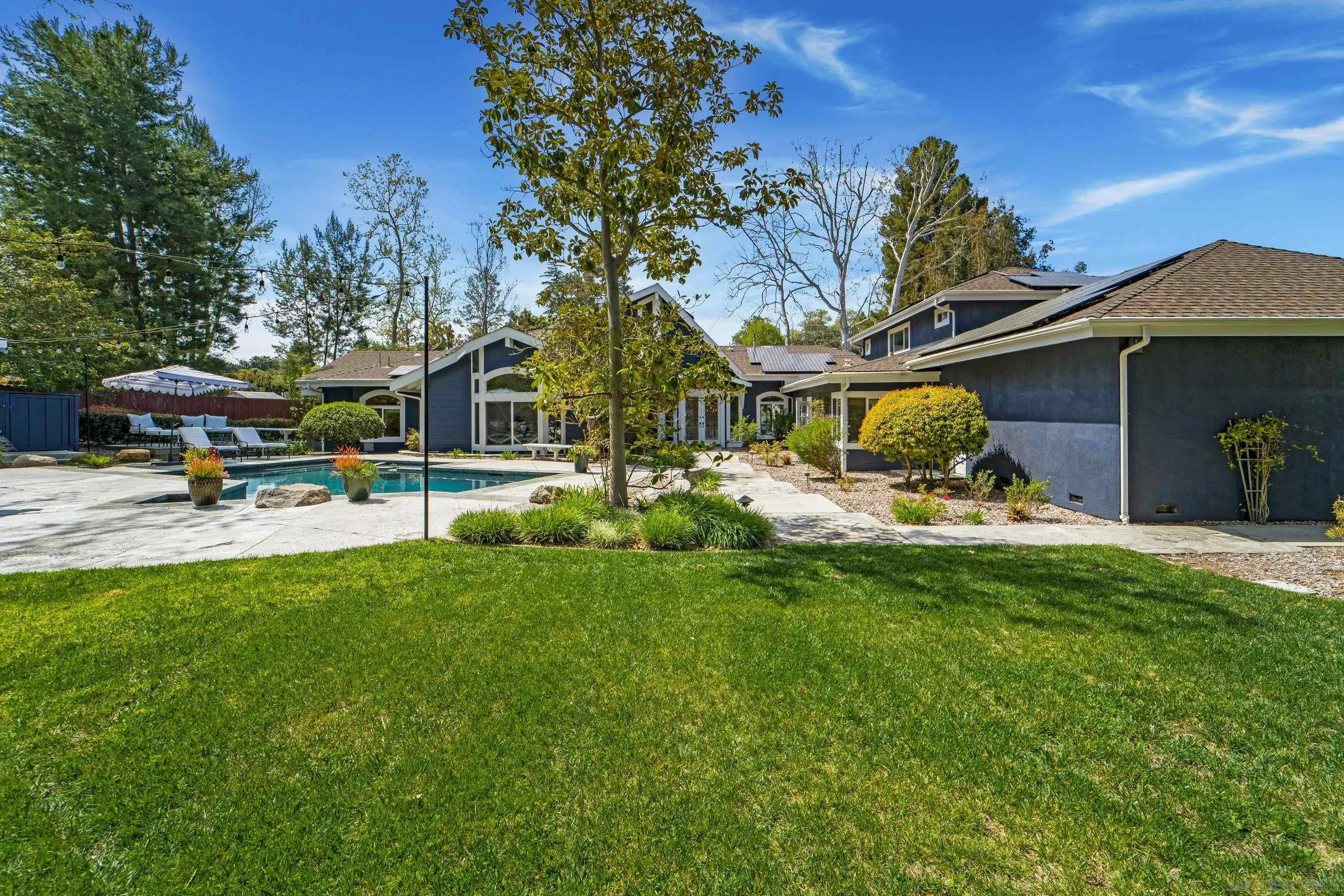 16163 Del Norte Poway, CA 92064 - Photo 27 of 41 a view of a house with garden and a bench
