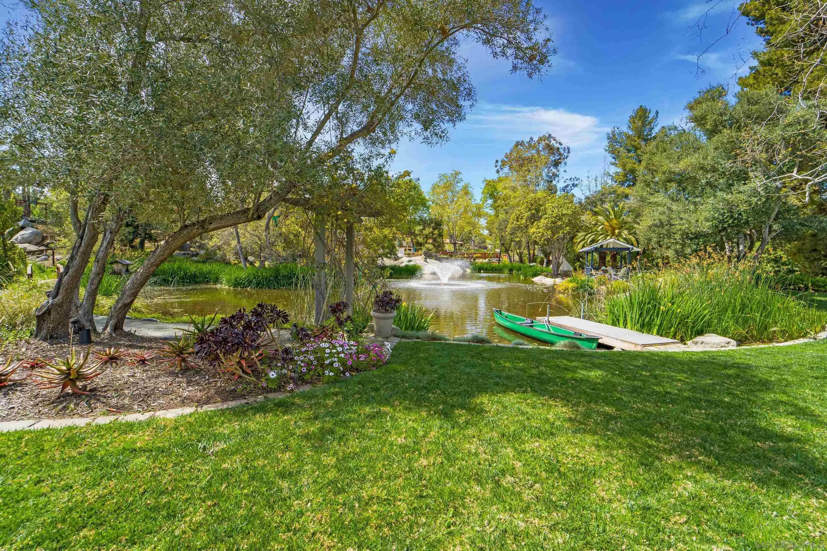 16163 Del Norte Poway, CA 92064 - Photo 35 of 41 a view of a lake with a garden