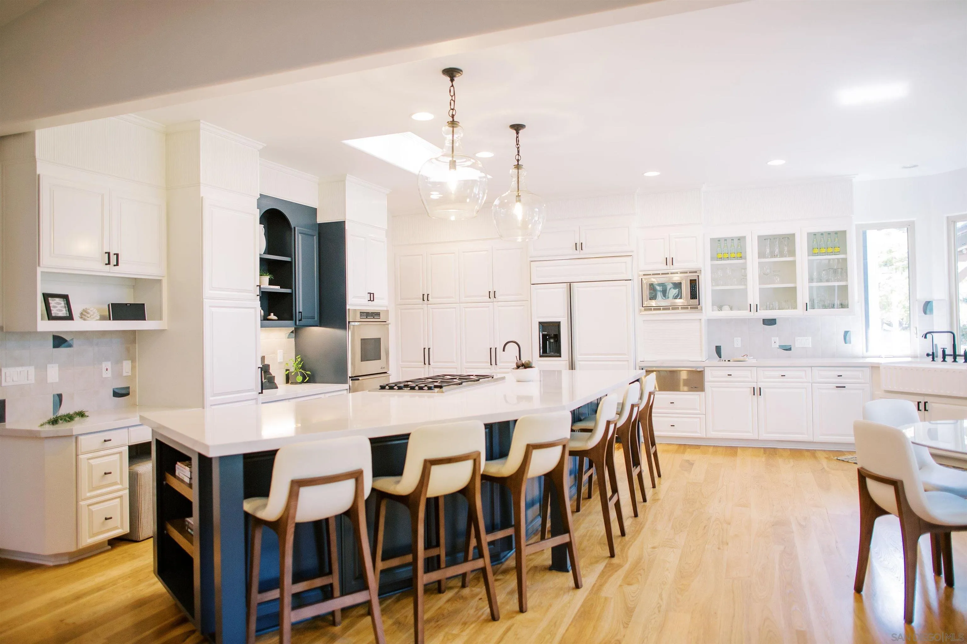16163 Del Norte Poway, CA 92064 - Photo 7 of 41 a large kitchen with a table and chairs