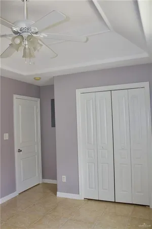 a view of a livingroom with a chandelier fan