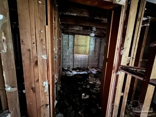 a view of a wooden house with a yard