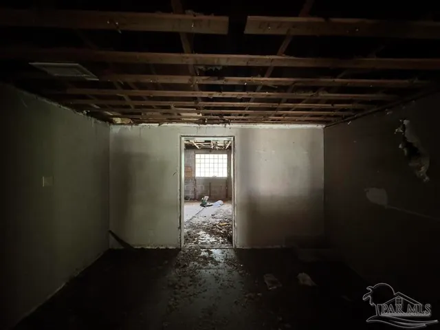 a big yard with lots of green space and house