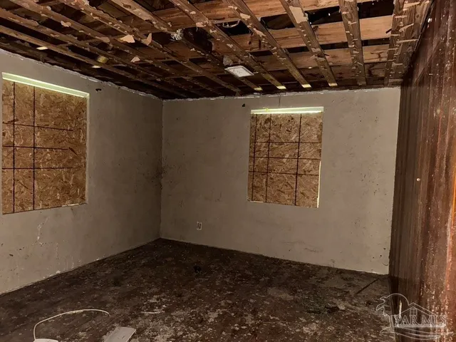 a view of a chairs and table in backyard of the house