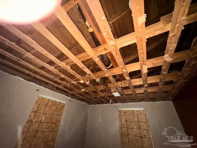 a view of a porch with chairs and backyard