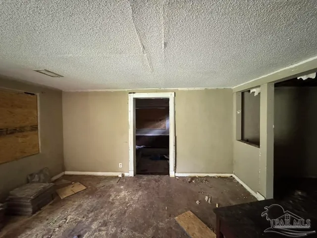 a view of a refrigerator and a stove