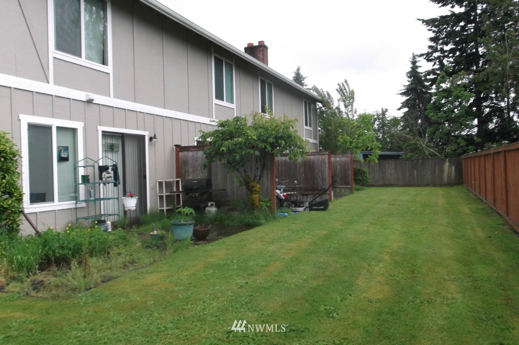 5116 Parker Road East Sumner, WA 98390 - Photo 7 of 8 a backyard of a house with seating space