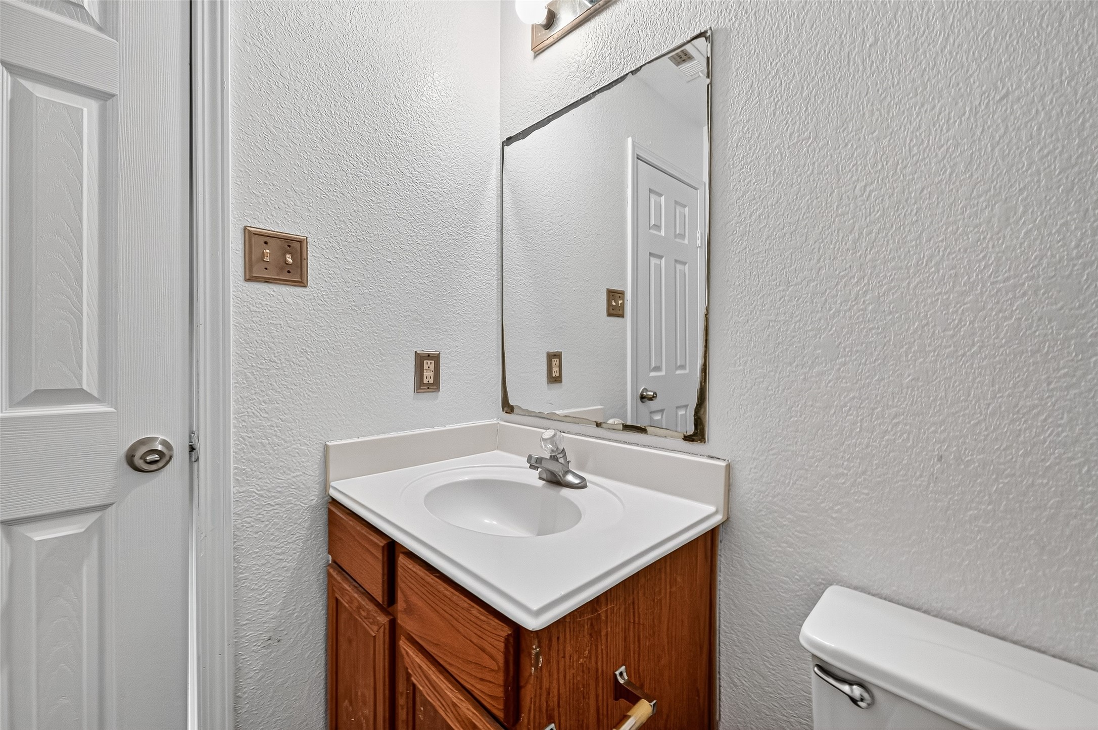 22819 Cabanna Road Spring, TX 77389 - Photo 19 of 26 a bathroom with a sink toilet and vanity