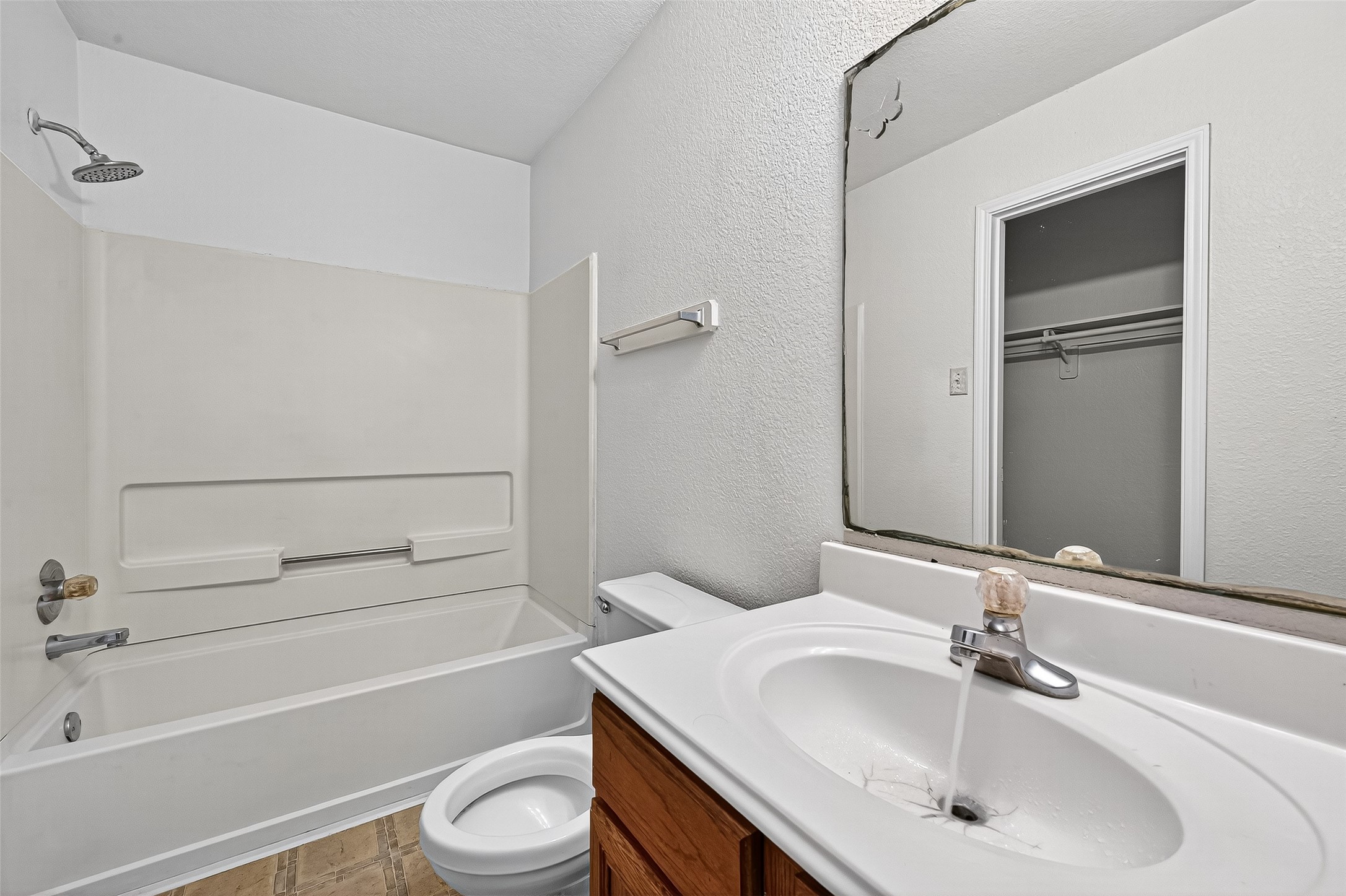 22819 Cabanna Road Spring, TX 77389 - Photo 22 of 26 a bathroom with a sink toilet and shower