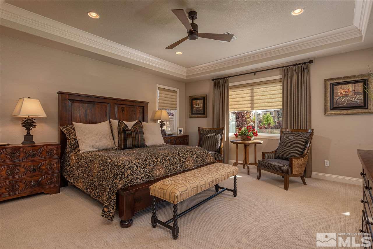 2060 Blue Boy Lane Reno, NV 89521 - Photo 13 of 25 a spacious bedroom with a bed and a couch