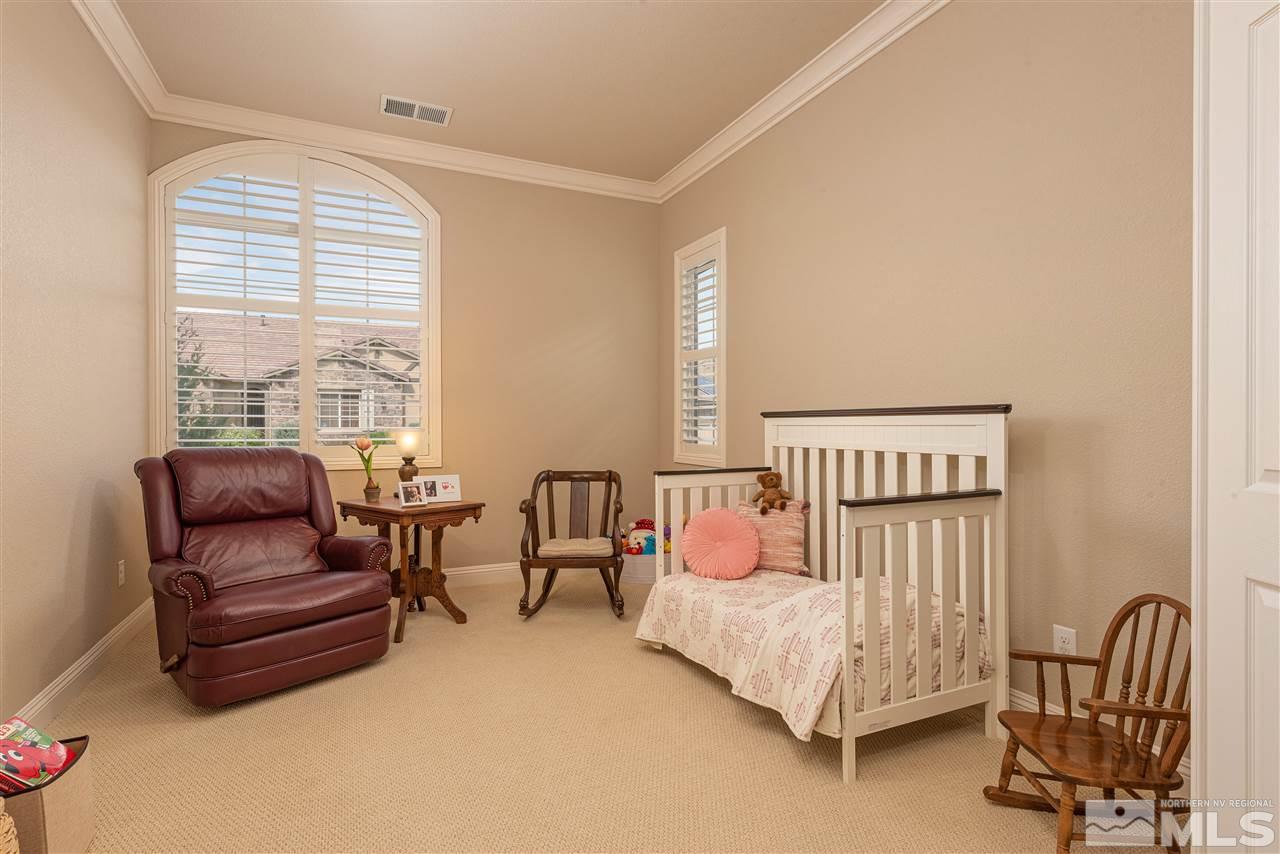 2060 Blue Boy Lane Reno, NV 89521 - Photo 17 of 25 a bedroom with furniture and a window
