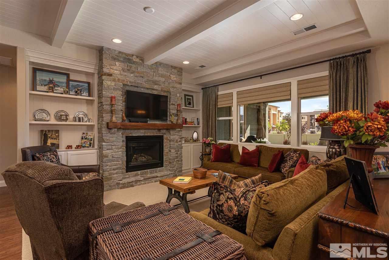 2060 Blue Boy Lane Reno, NV 89521 - Photo 6 of 25 a living room with furniture a flat screen tv and a fireplace