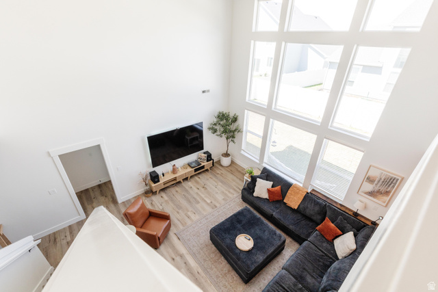 349 West 3085 South Logan, UT 84321 - Photo 27 of 37 Spacious living area featuring a vaulted ceiling and extensive window array