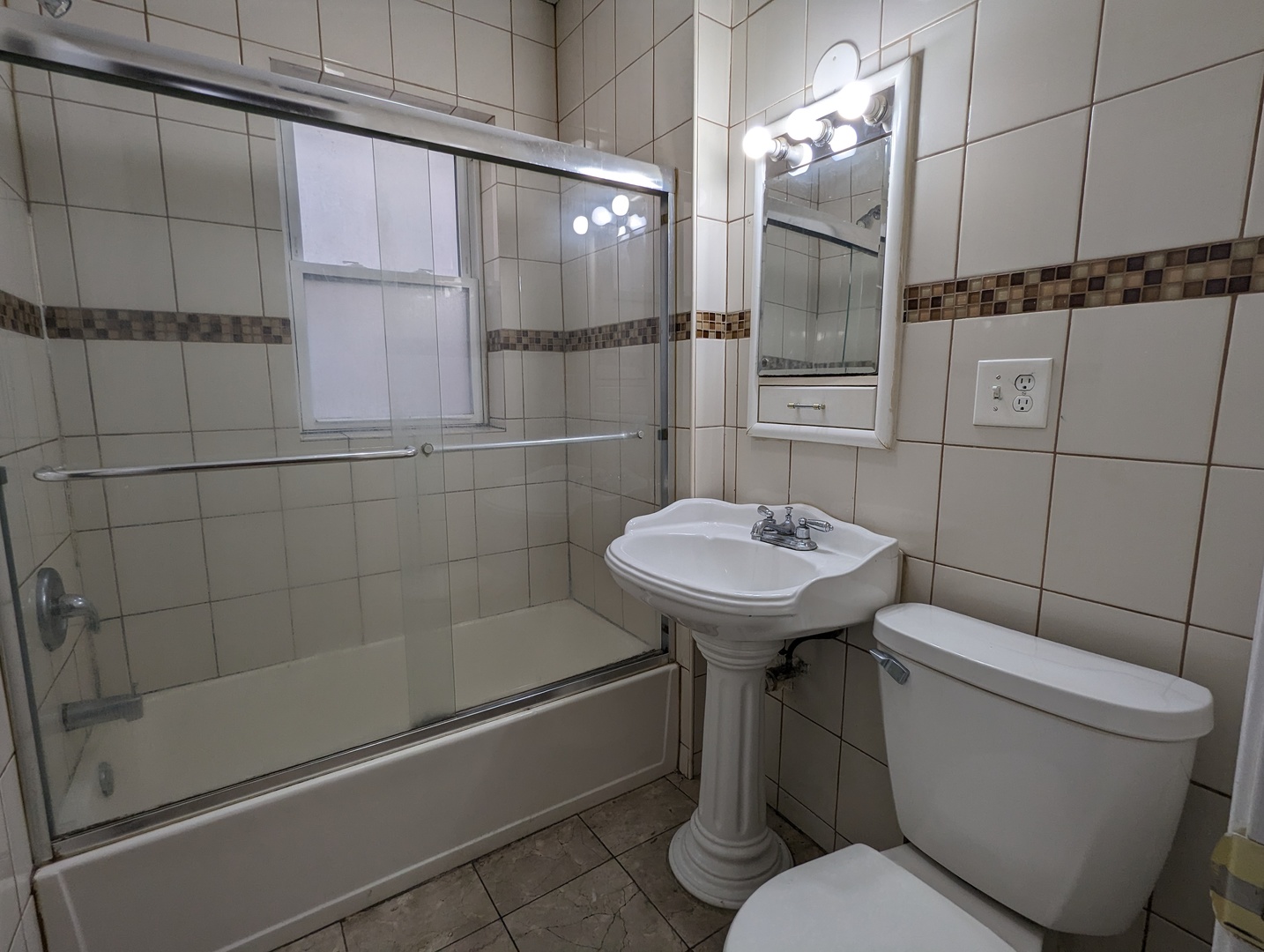 5029 North Harding Avenue, Unit 1W Chicago, IL 60625 - Photo 13 of 18 a bathroom with a sink a toilet and shower