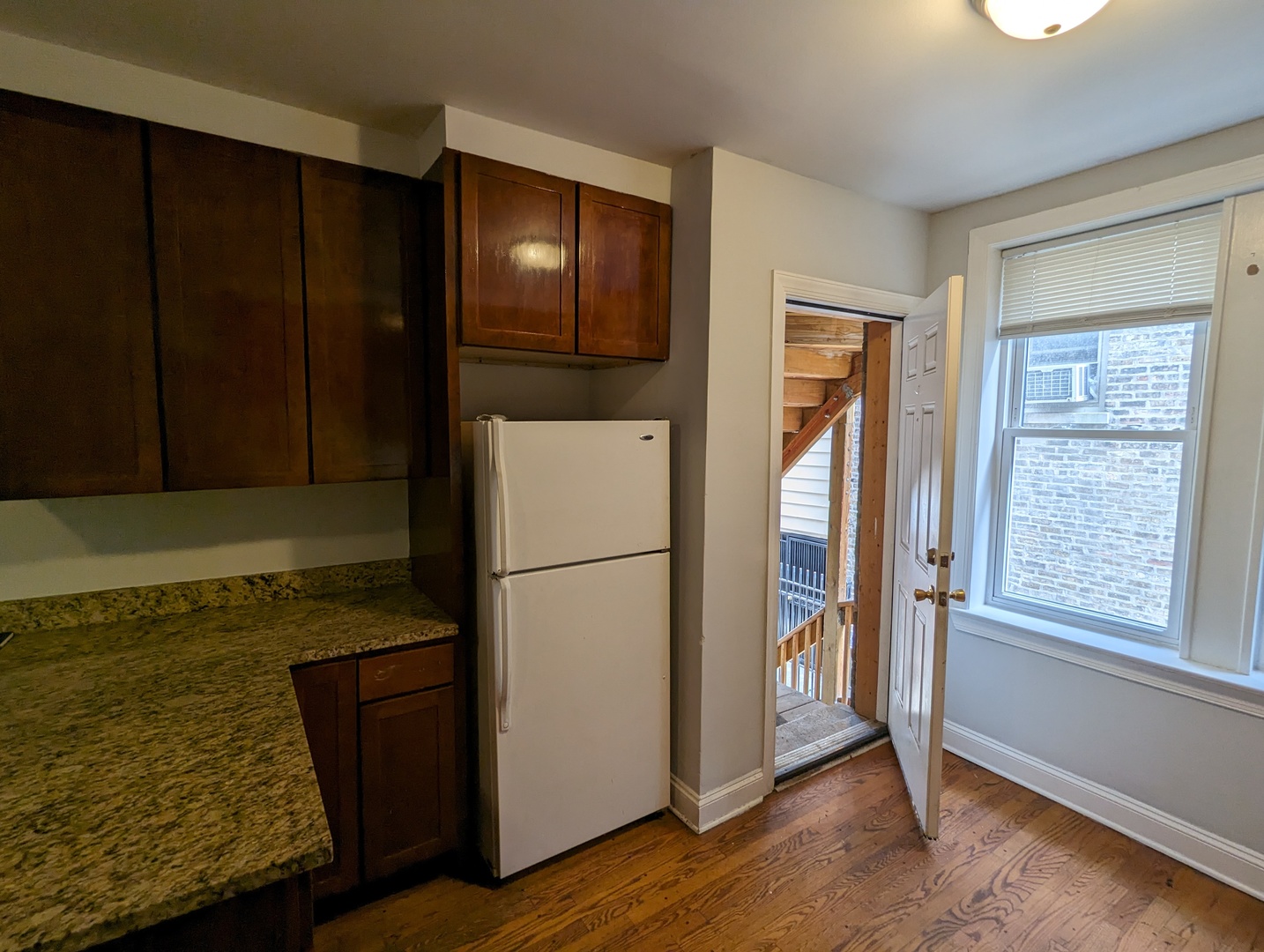 5029 North Harding Avenue, Unit 1W Chicago, IL 60625 - Photo 10 of 18 a view of washer and dryer with wooden floor