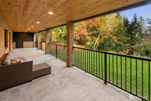 a big house with a big yard and large trees