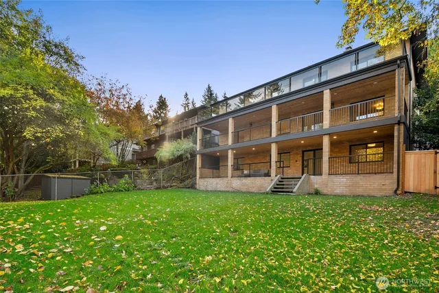 a view of green field with trees in the background