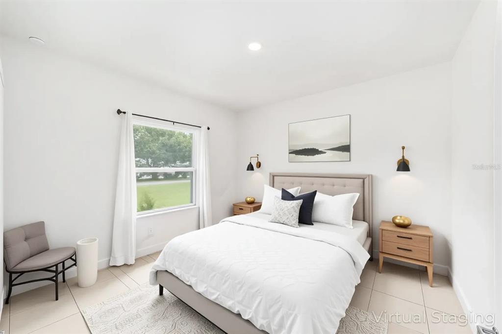 11102 Southwest 58th Avenue Road Ocala, FL 34476 - Photo 29 of 47 a bedroom with a bed and a window