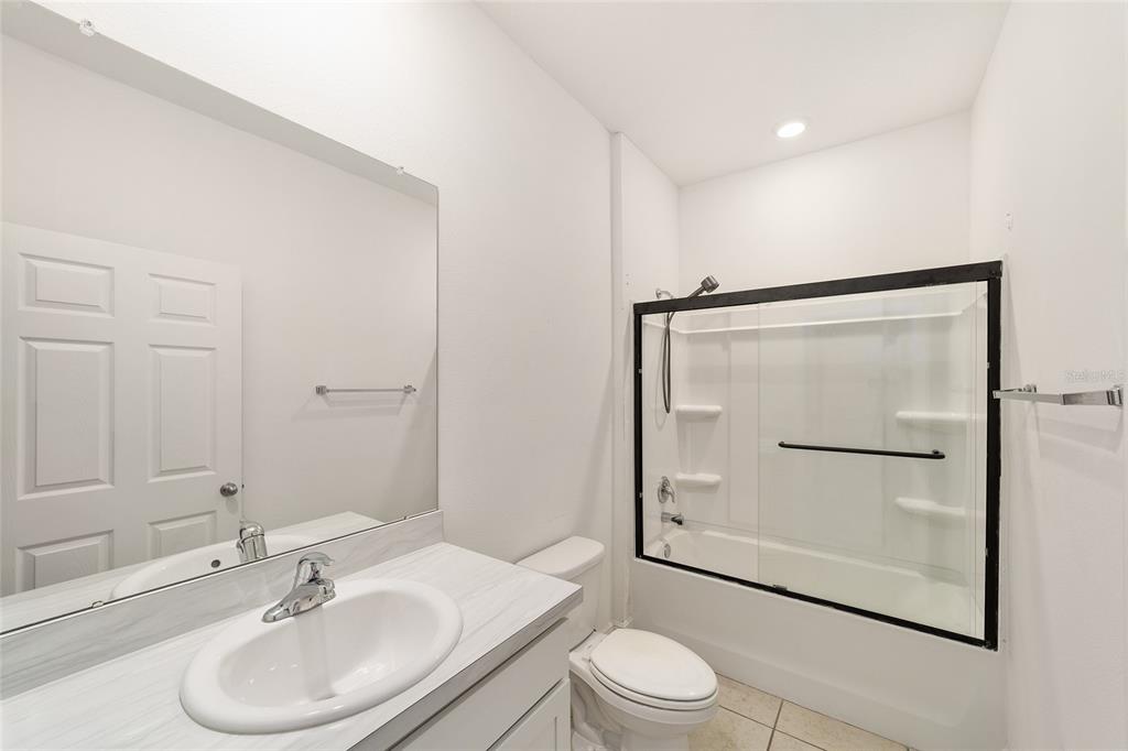 11102 Southwest 58th Avenue Road Ocala, FL 34476 - Photo 31 of 47 a bathroom with a sink toilet and shower