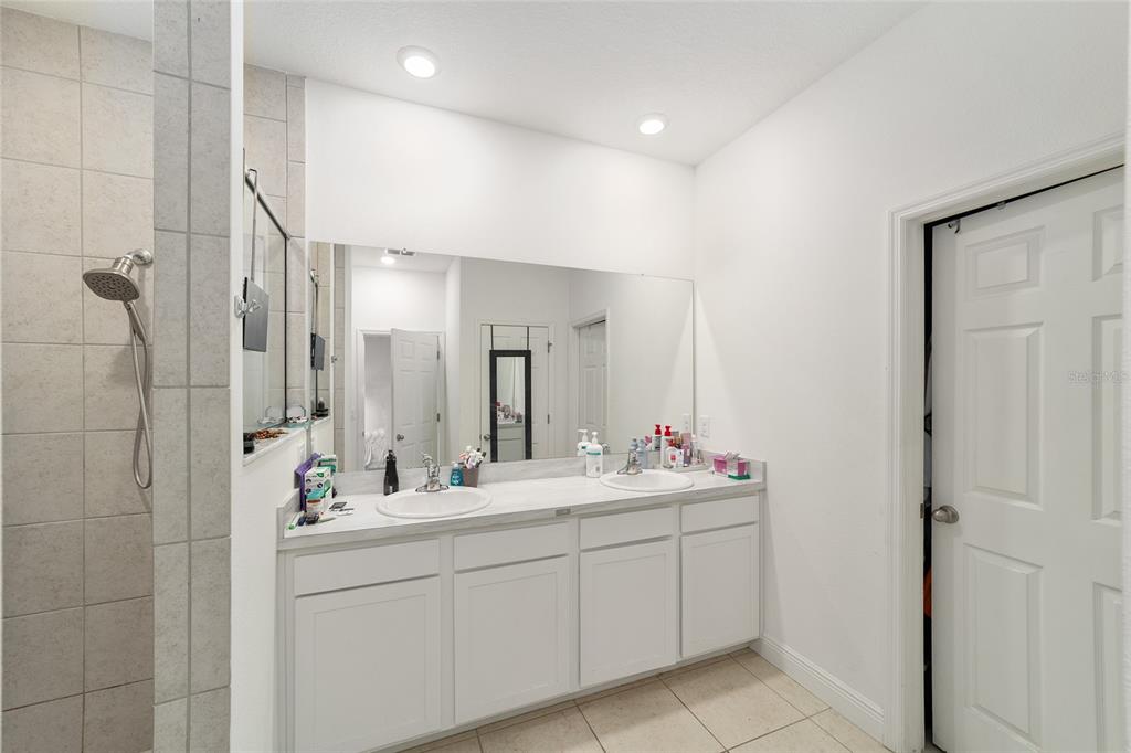 11102 Southwest 58th Avenue Road Ocala, FL 34476 - Photo 37 of 47 a bathroom with a double vanity sink mirror and double
