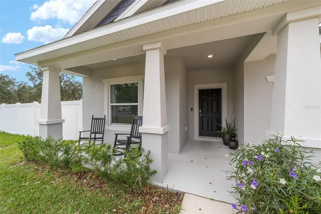a large white kitchen with stainless steel appliances lots of counter top space