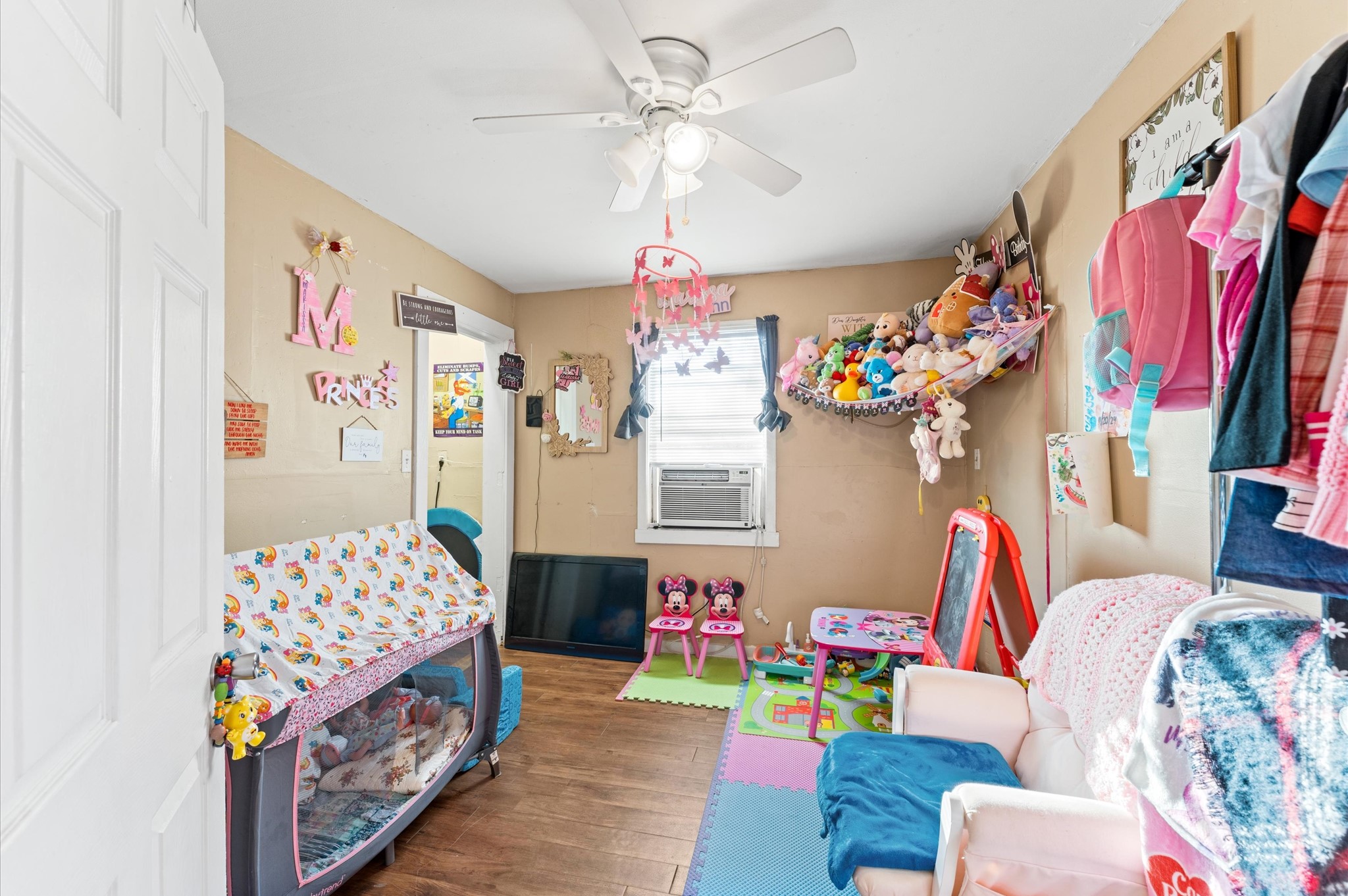 1605 Walnut Avenue Rosenberg, TX 77471 - Photo 12 of 29 a bedroom with a bed and a couch