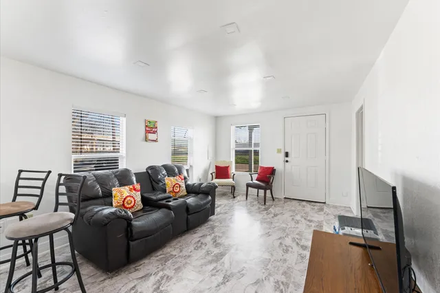 a living room with furniture and a window