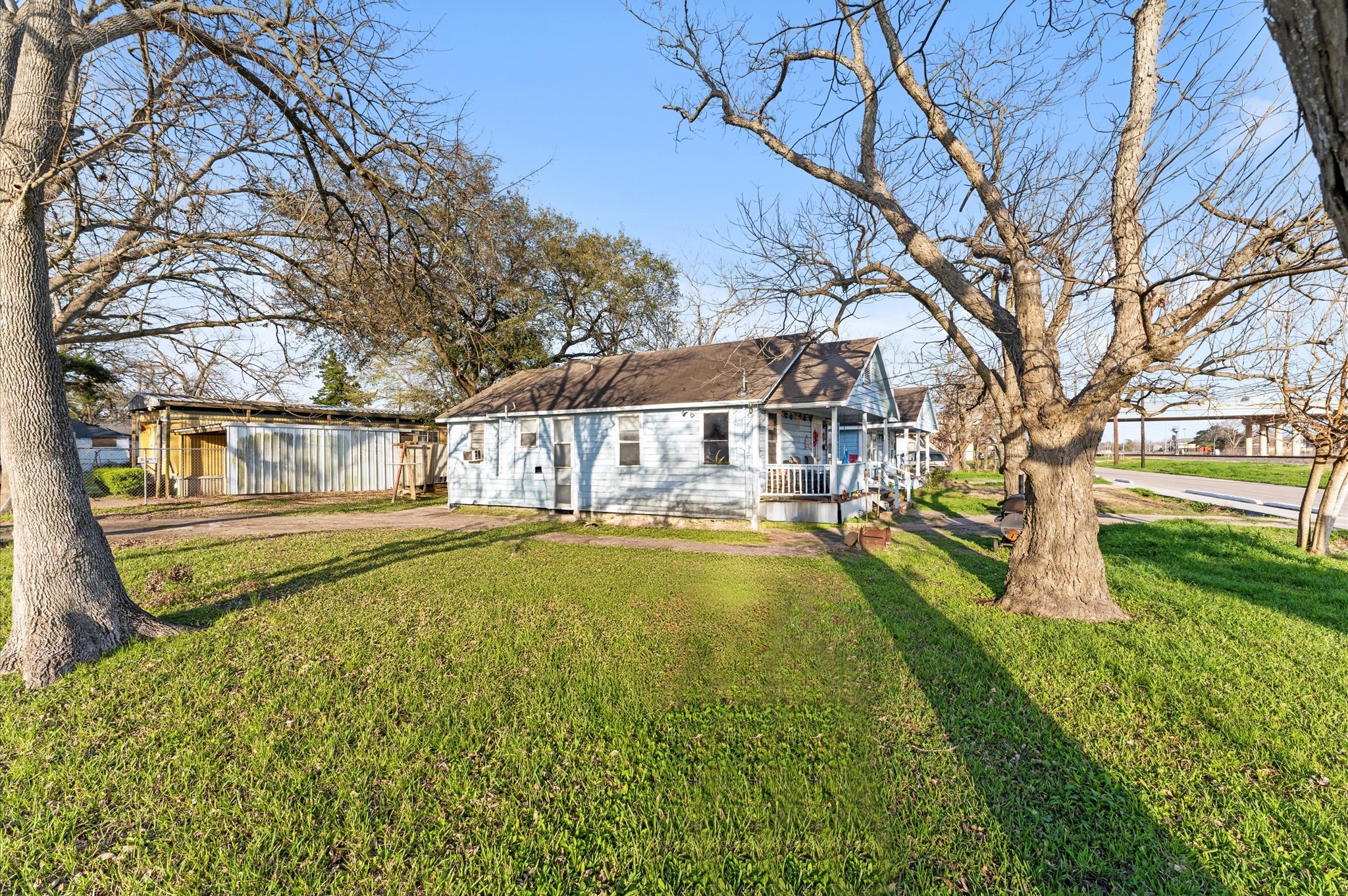 1605 Walnut Avenue Rosenberg, TX 77471 - Photo 2 of 29 a swimming pool with outdoor seating and yard