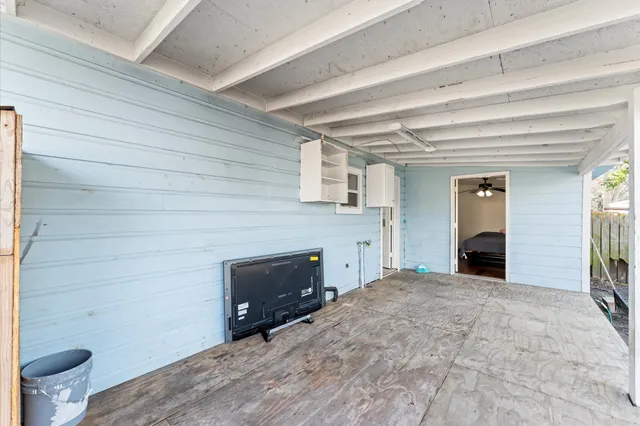 a view of a hallway with toilet and a fireplace