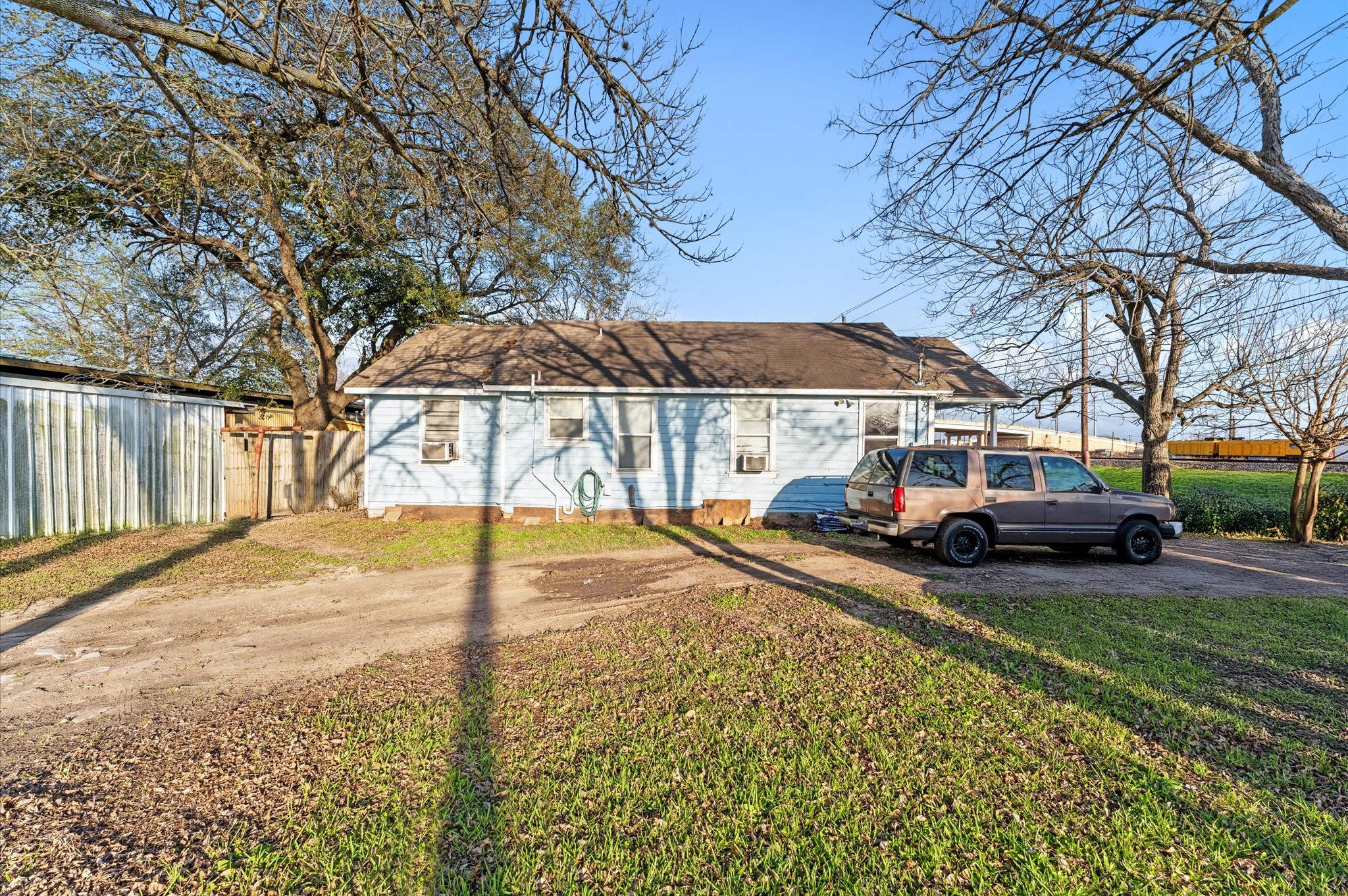 1605 Walnut Avenue Rosenberg, TX 77471 - Photo 3 of 29 a view of a yard with a house and a large tree