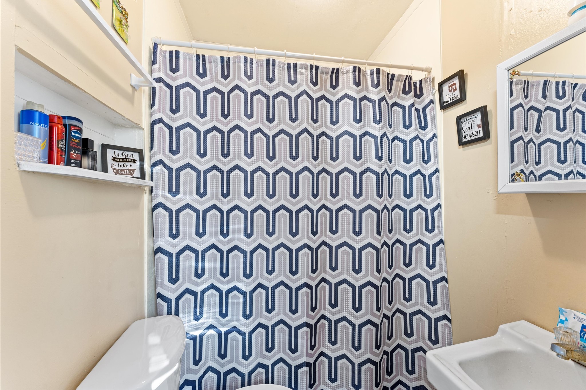 1605 Walnut Avenue Rosenberg, TX 77471 - Photo 10 of 29 a bathroom with a bathtub and a shower curtain