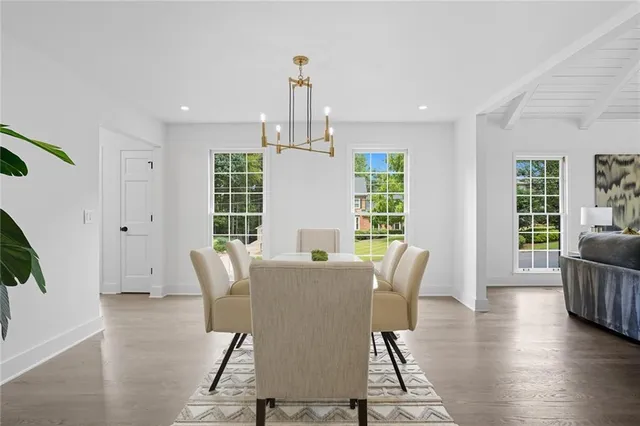 a view of a dining room with furniture window and wooden floor