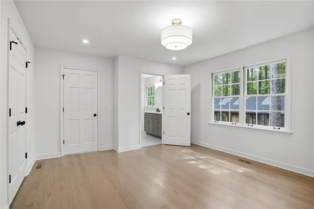 an empty room with a empty space and windows