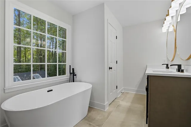 a bathroom with a bathtub and a sink