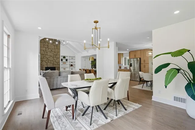a view of a dining room with furniture window and wooden floor