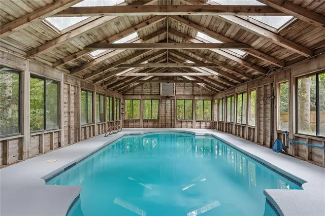 a view of swimming pool with seating space