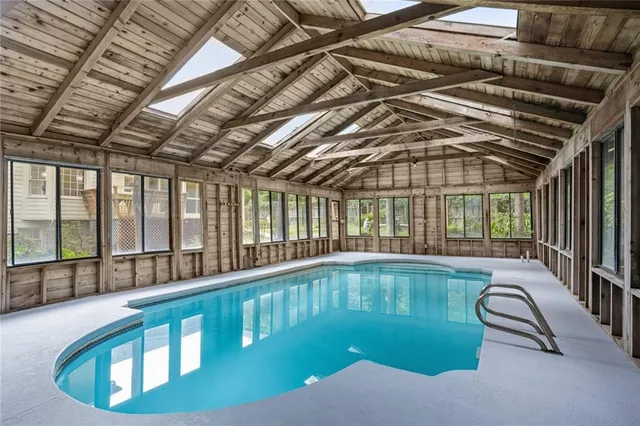 a view of a house with backyard and garden