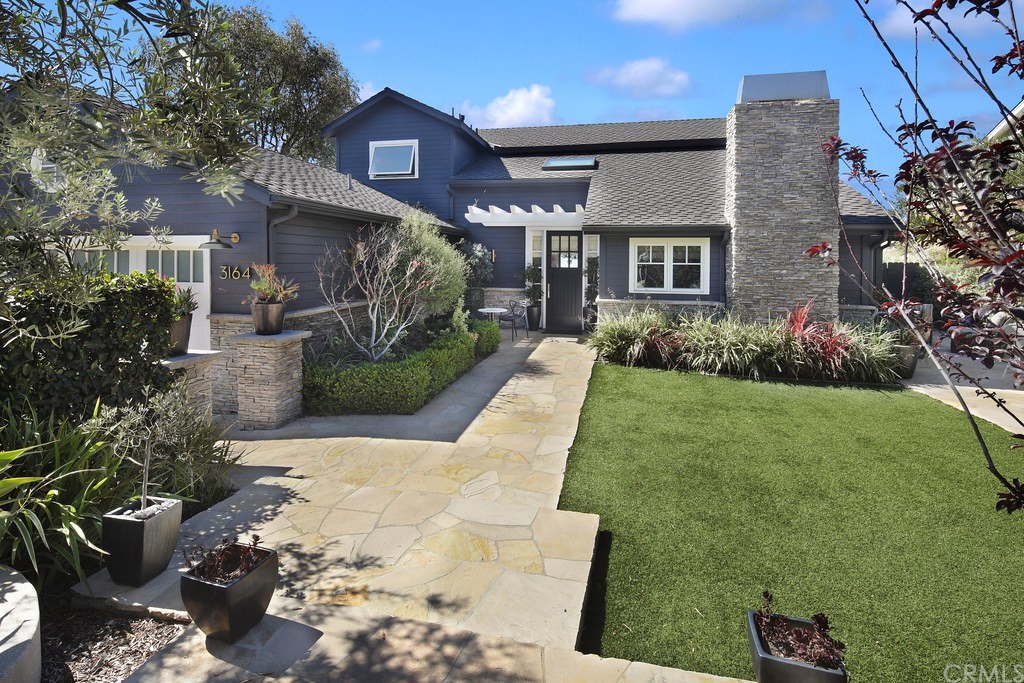 3164 Bern Drive Laguna Beach, CA 92651 - Photo 1 of 33 a front view of a house with a garden
