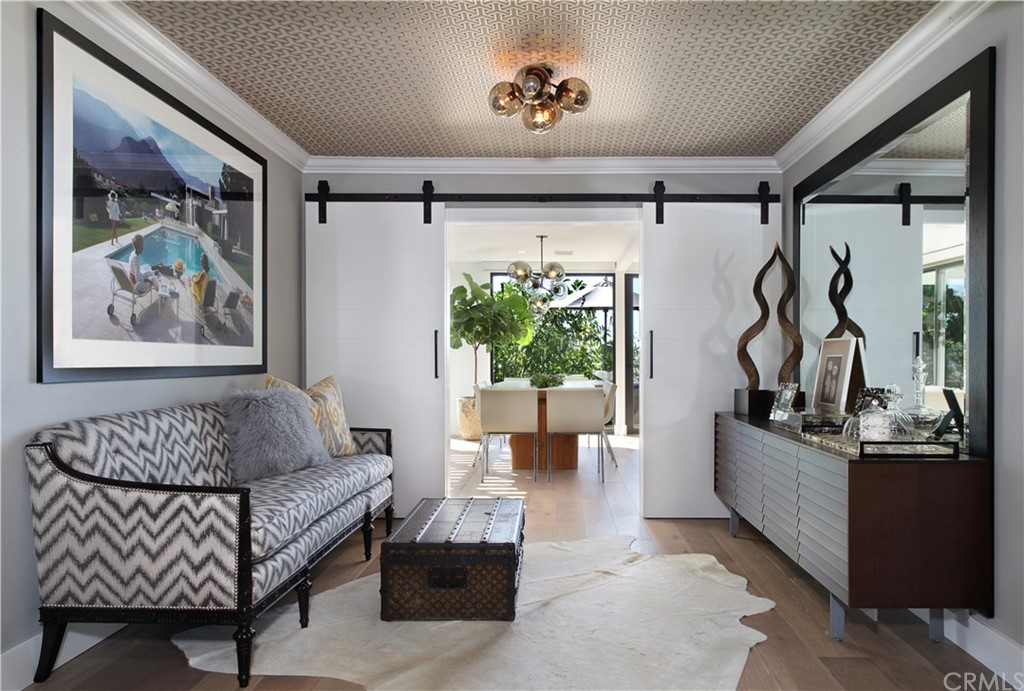 3164 Bern Drive Laguna Beach, CA 92651 - Photo 11 of 33 a living room with furniture stairs and a window