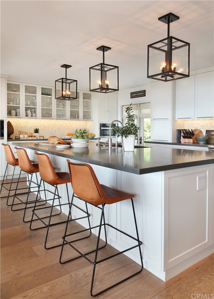 3164 Bern Drive Laguna Beach, CA 92651 - Photo 3 of 33 a kitchen with stainless steel appliances granite countertop a stove a sink and a refrigerator