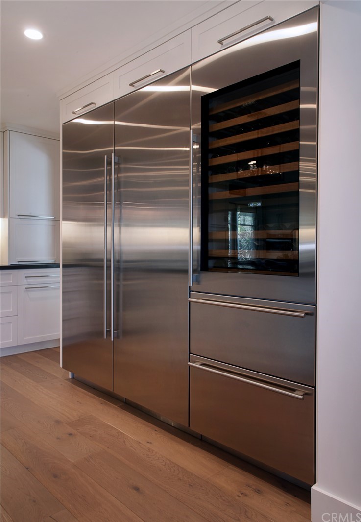 3164 Bern Drive Laguna Beach, CA 92651 - Photo 5 of 33 a refrigerator in a kitchen and an empty room