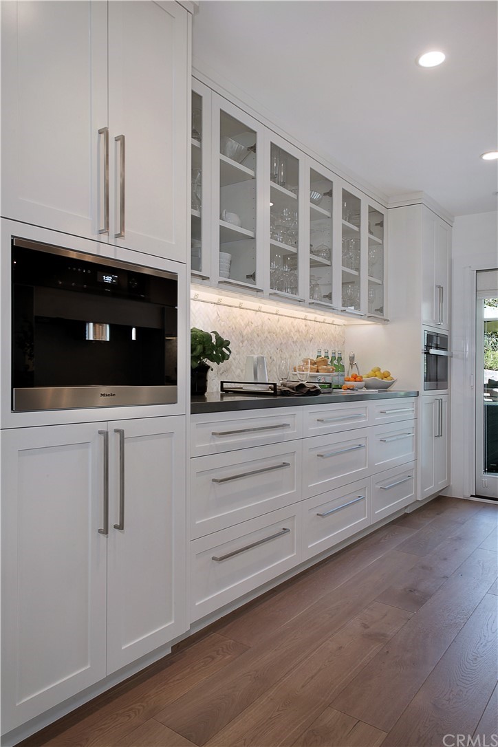 3164 Bern Drive Laguna Beach, CA 92651 - Photo 6 of 33 a kitchen with white cabinets and a oven