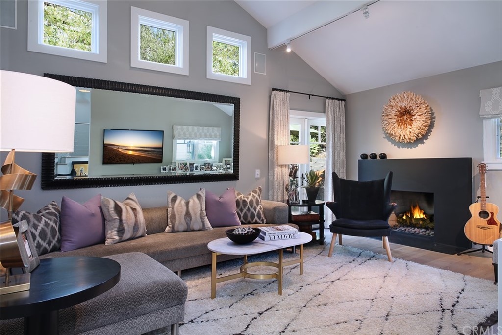 3164 Bern Drive Laguna Beach, CA 92651 - Photo 7 of 33 a living room with furniture and a fireplace