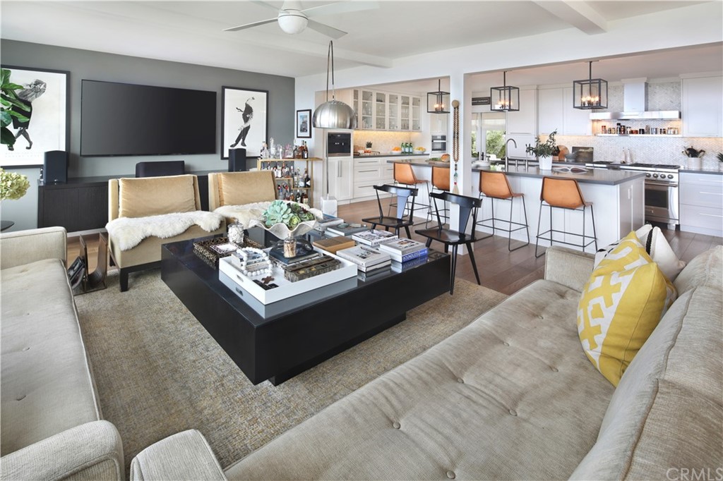 3164 Bern Drive Laguna Beach, CA 92651 - Photo 8 of 33 a living room with furniture kitchen view and a flat screen tv