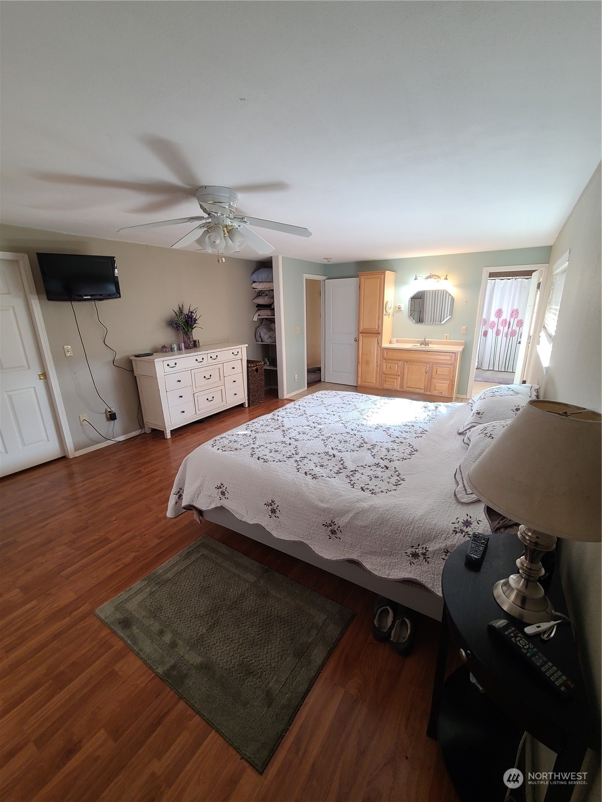 333 Johnson Road Selah, WA 98942 - Photo 11 of 21 a bedroom with a bed and wooden floor