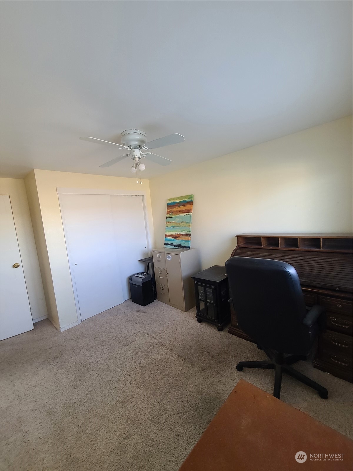 333 Johnson Road Selah, WA 98942 - Photo 15 of 21 a bedroom with a bed and cabinets