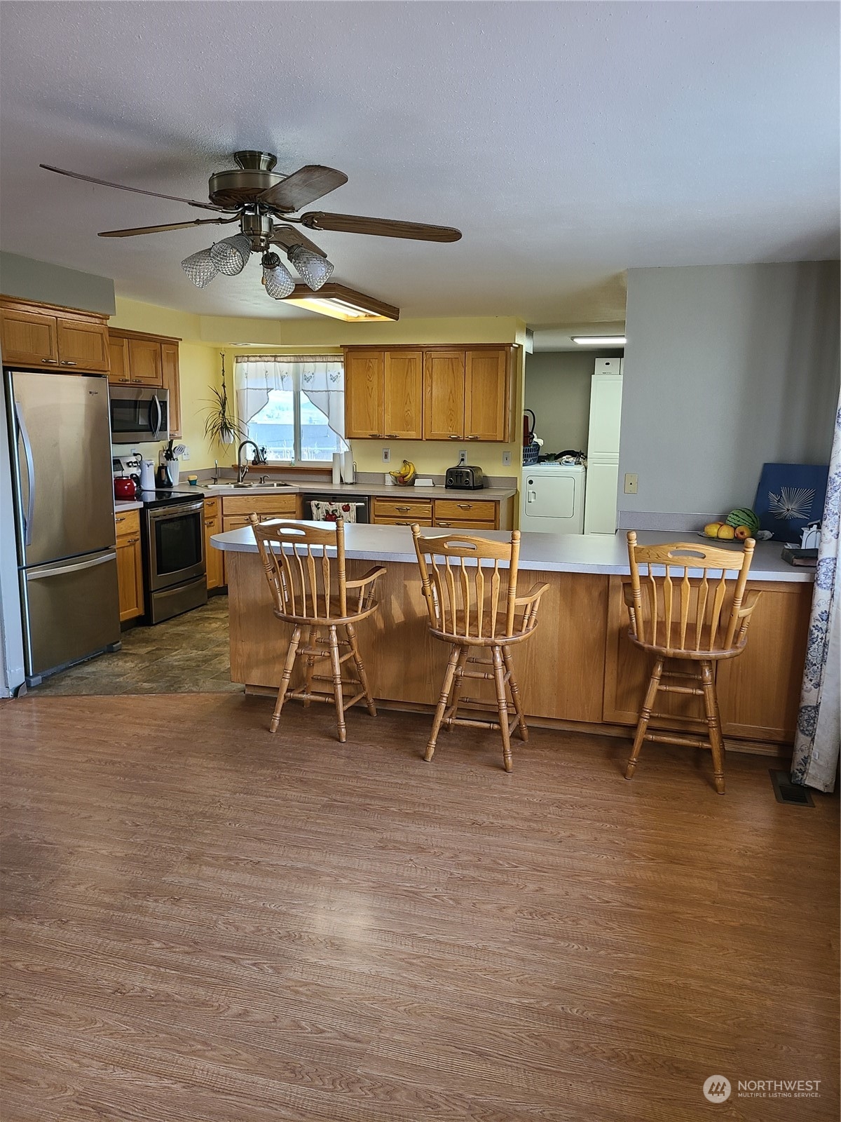 333 Johnson Road Selah, WA 98942 - Photo 8 of 21 a view of a dining room with furniture window and wooden floor