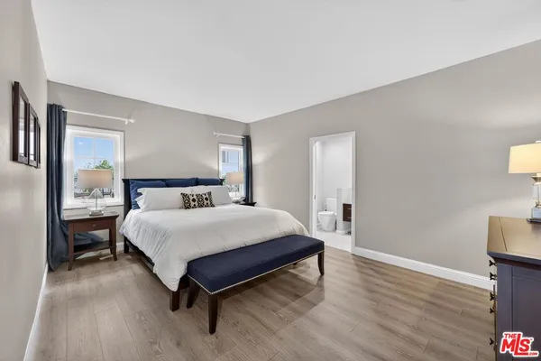 a bedroom with a bed and a table
